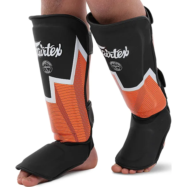 Защитные накладки на ноги Муай Тай, ММА, Кикбоксинг кожаная FAIRTEX BO-9486 (Черный-оранжевый)