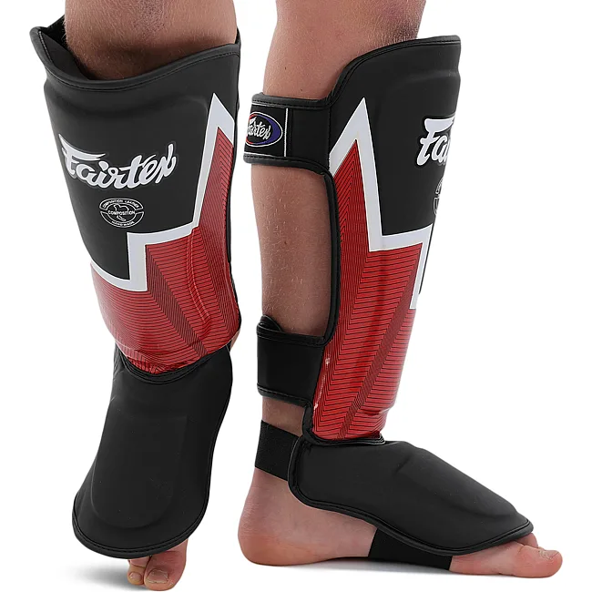 Защитные накладки на ноги Муай Тай, ММА, Кикбоксинг кожаная FAIRTEX BO-9486 (Черный-оранжевый)