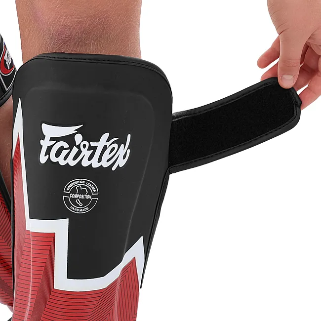 Защитные накладки на ноги Муай Тай, ММА, Кикбоксинг кожаная FAIRTEX BO-9486 (Черный-оранжевый)