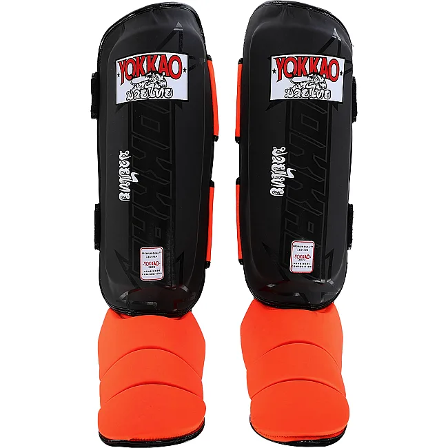 Защитные накладки на ноги
 Муай Тай, ММА, Кикбоксинг кожаная YOKKAO BO-5032 (Черный-оранжевый)