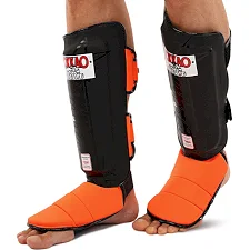 Защитные накладки на ноги Муай Тай, ММА, Кикбоксинг кожаная YOKKAO BO-5032 (Черный-оранжевый)